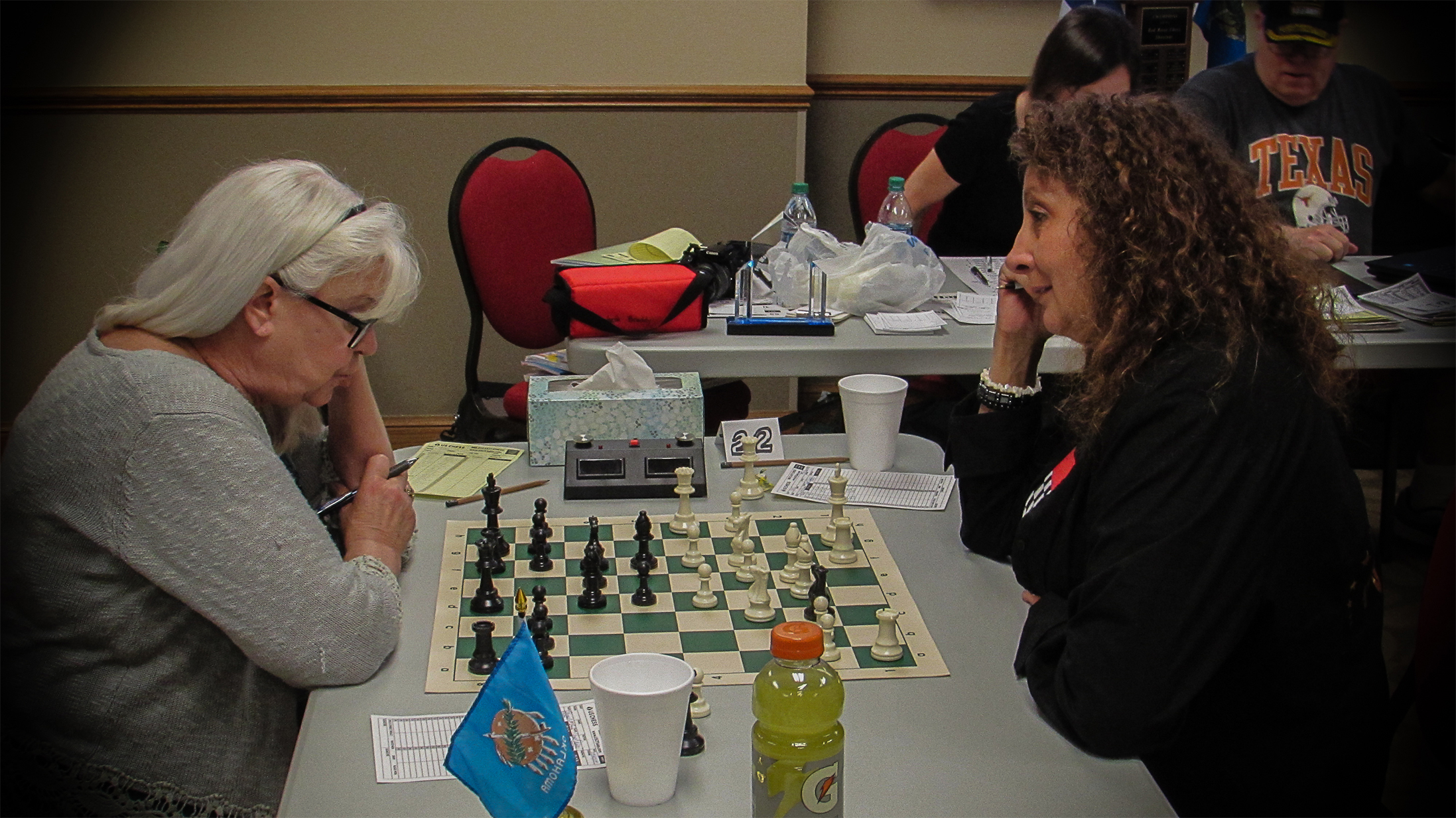 Some players finished early and eagerly sought rating points by playing extra rated games.  A total of nine G/30 games were played, such as this one between Carol Heise (left) and Sheryl McBroom (right).  Photo by Mike Tubbs.
